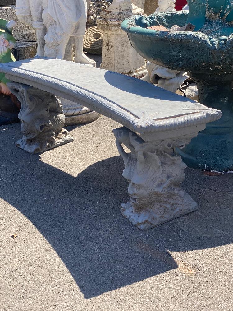 Concrete bench with figures