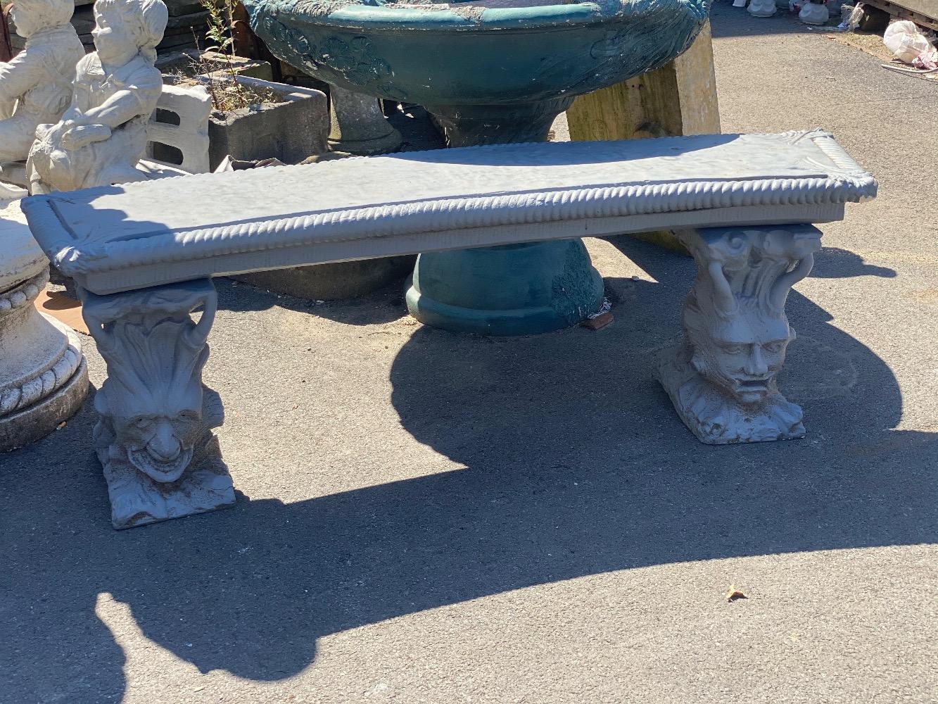Concrete bench with figures