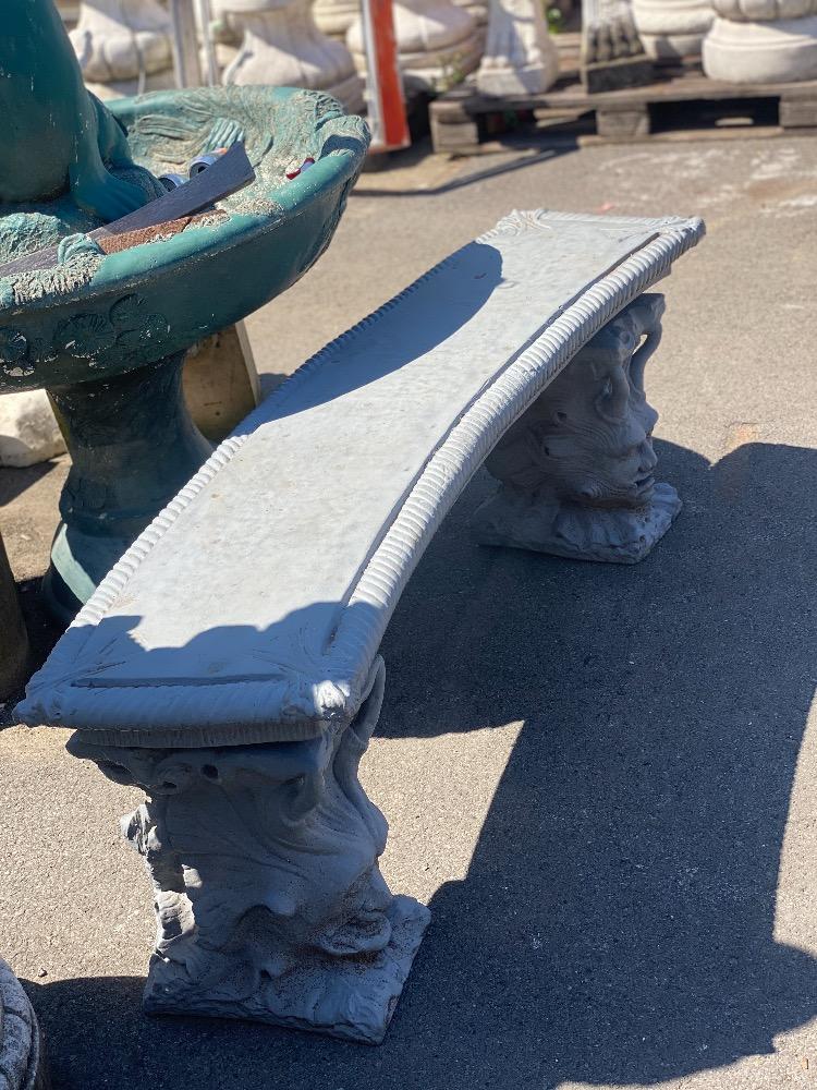 Concrete bench with figures